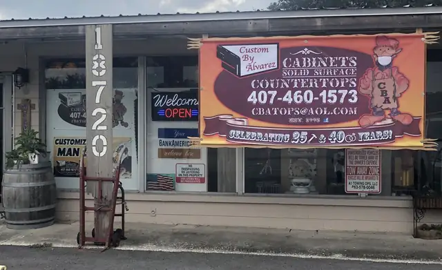 Custom By Alvarez storefront at 18720 US-27 in Lake Wales with its cabinets, solid surface and countertops banner